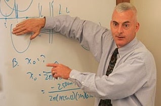 Person pointing to a whiteboard